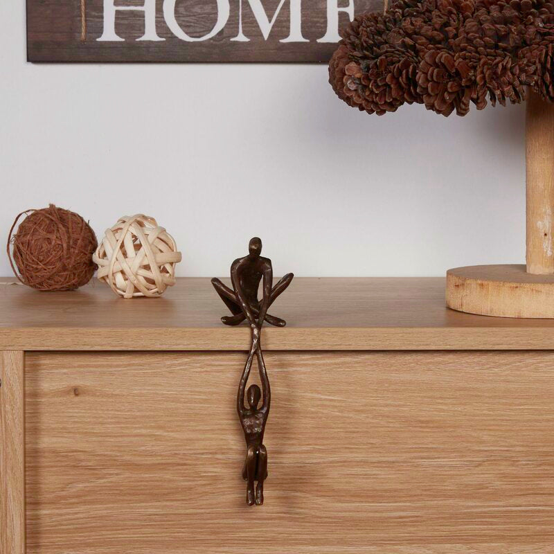 Ofrus Bronze Man Lifting Woman from Ledge Sculpture